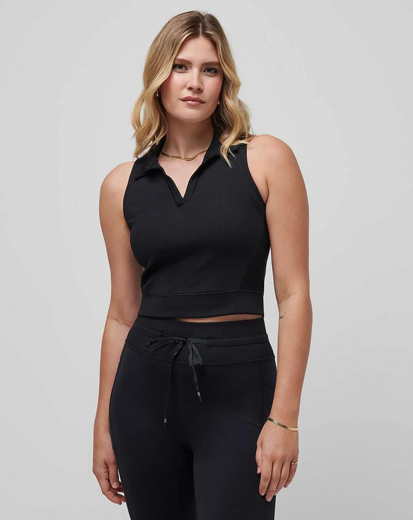 TravisMathew Moveknit Sleeveless Vneck Polo> Polos