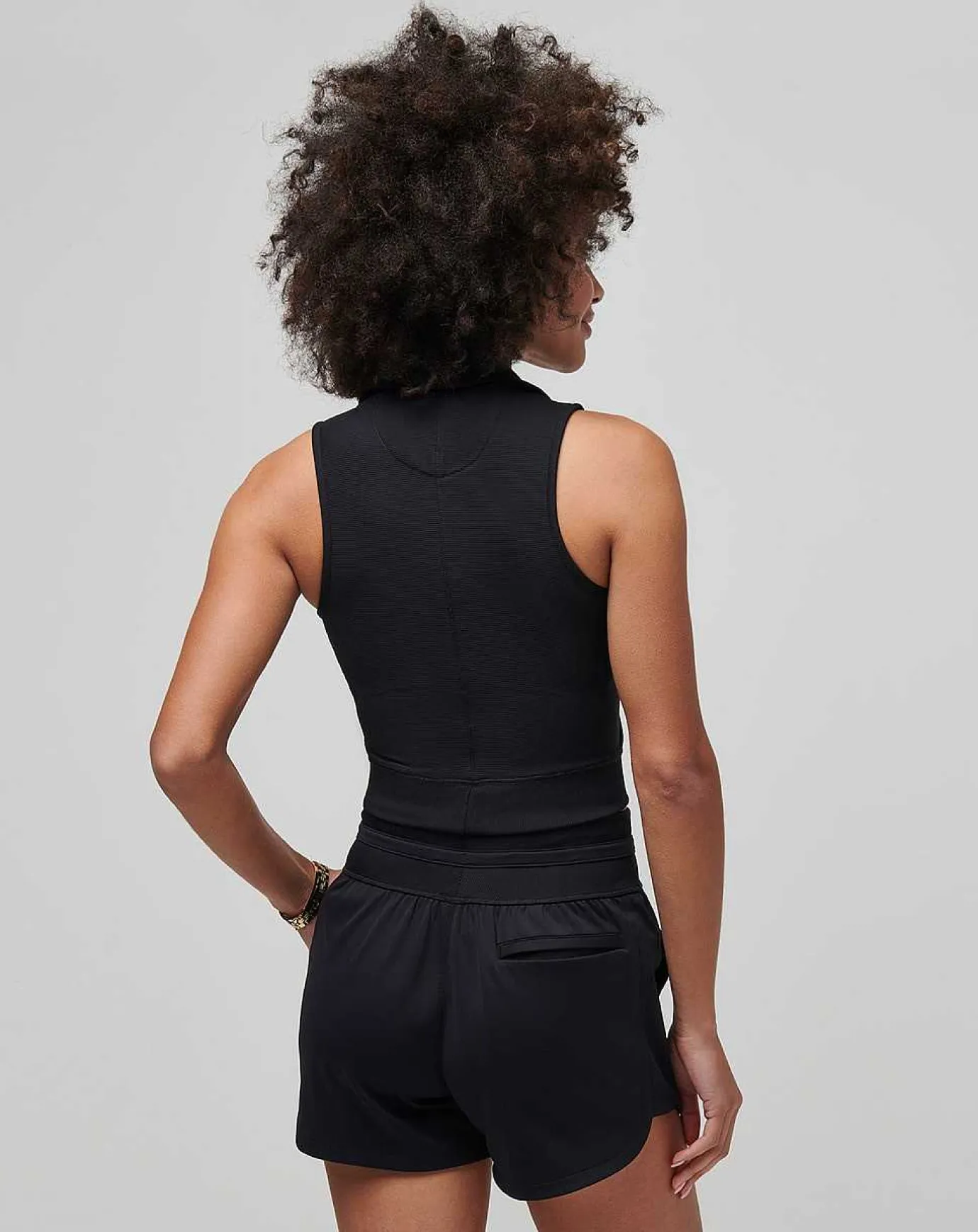 TravisMathew Moveknit Sleeveless Vneck Polo> Polos