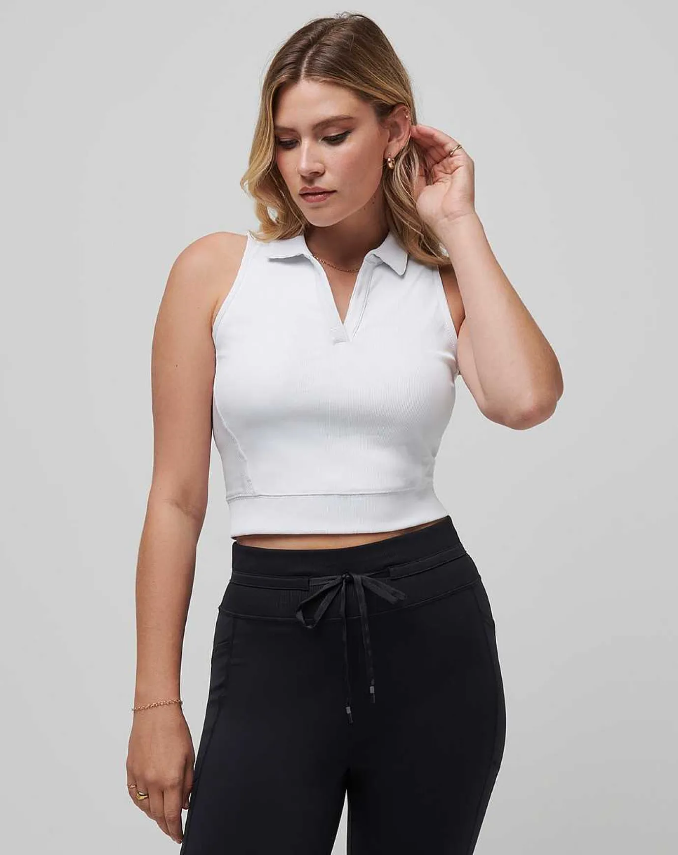 TravisMathew Moveknit Sleeveless Vneck Polo> Polos